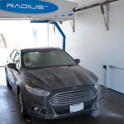 Car being rinsed in our touchless car wash near Hobson Park East, Oxnard CA.