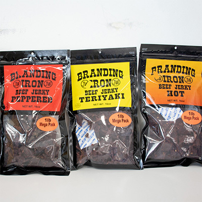 Three bags of Branding Iron Beef Jerky, some of our Carriage Square, Oxnard snacks.