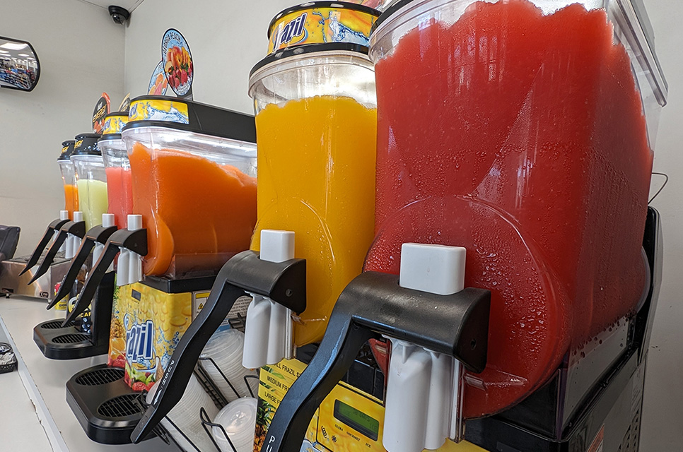 A row of Frazil Slushy machines, some of our beach supplies near Carriage Square, Oxnard, California.