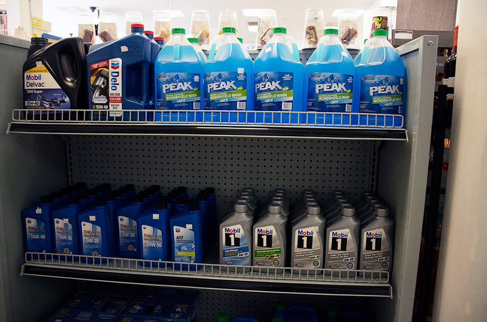 Two shelves of motor oil and washer fluid, some of our automotive supplies near Windsor North River Ridge, Oxnard, California.