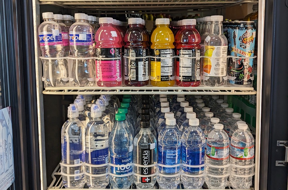 Bottles of cold water in a display case, some of our beach drinks near Orchard Park, Oxnard, California.