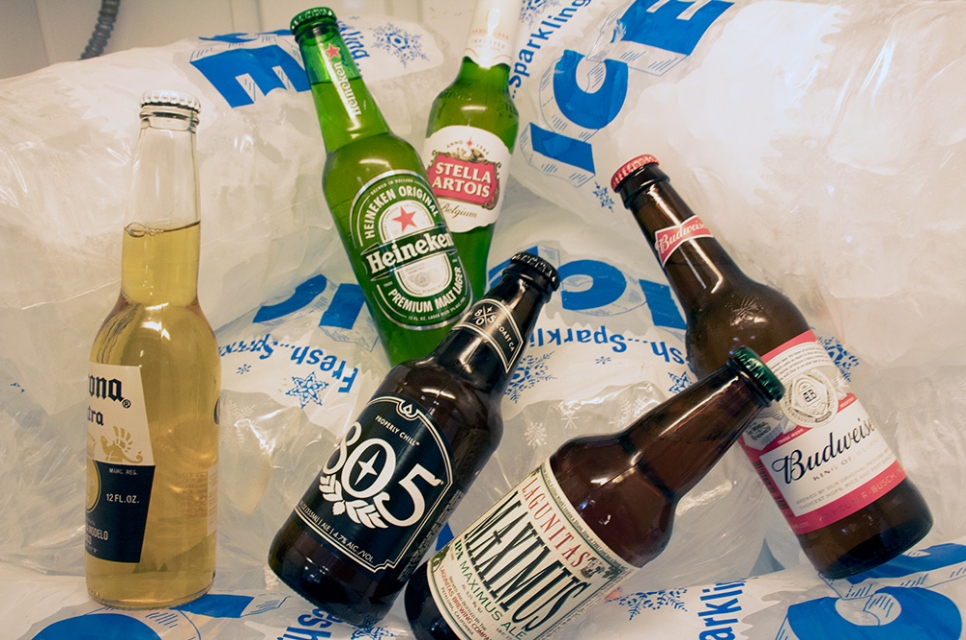 Beer bottles sitting on top of our Riverpark, Oxnard bagged ice for sale.